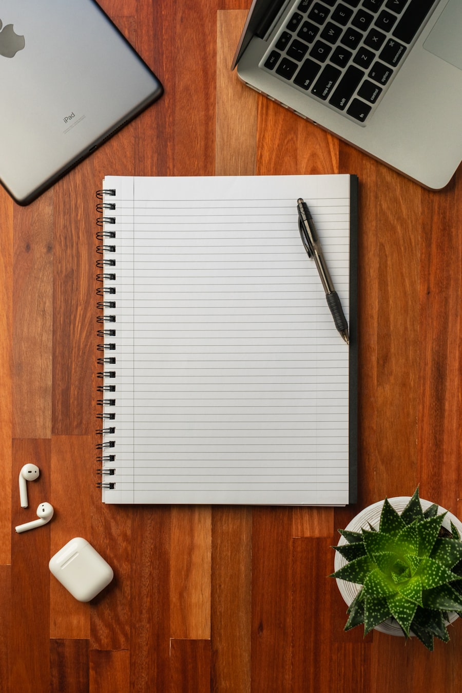 A creative desk with notebooks and pens