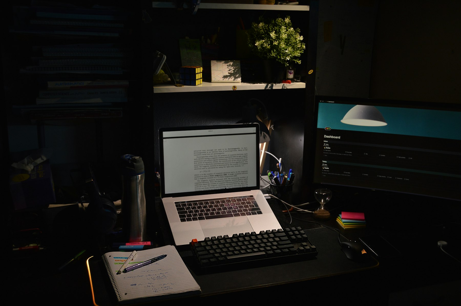 A moody desk of art supplies